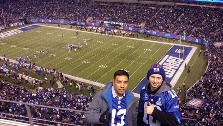 Two men at a New York Giants football game at MetLife Stadium